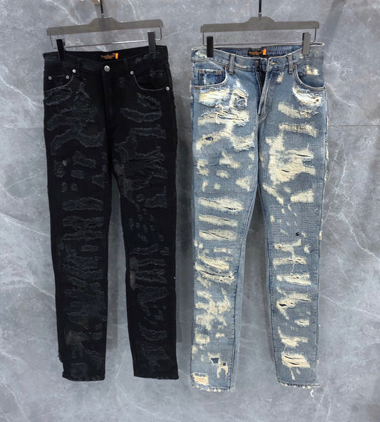 Blue And Black Cow Embroidered Cotton Jeans With Distressed Detailing